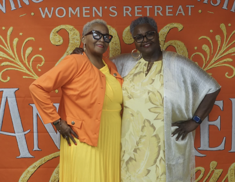 Two women smiling together at the retreat